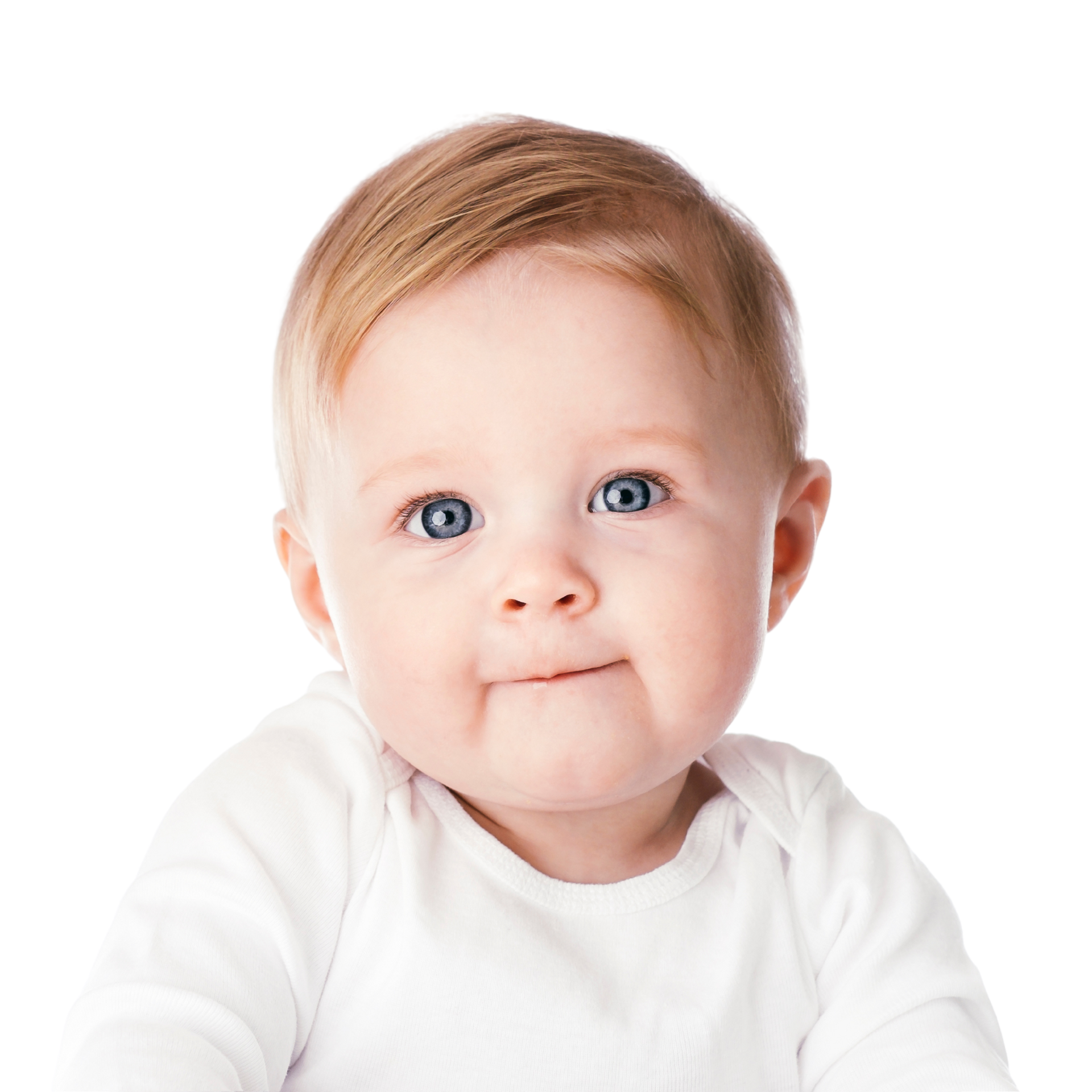 A close up of a smiling baby boy with big blue eyes